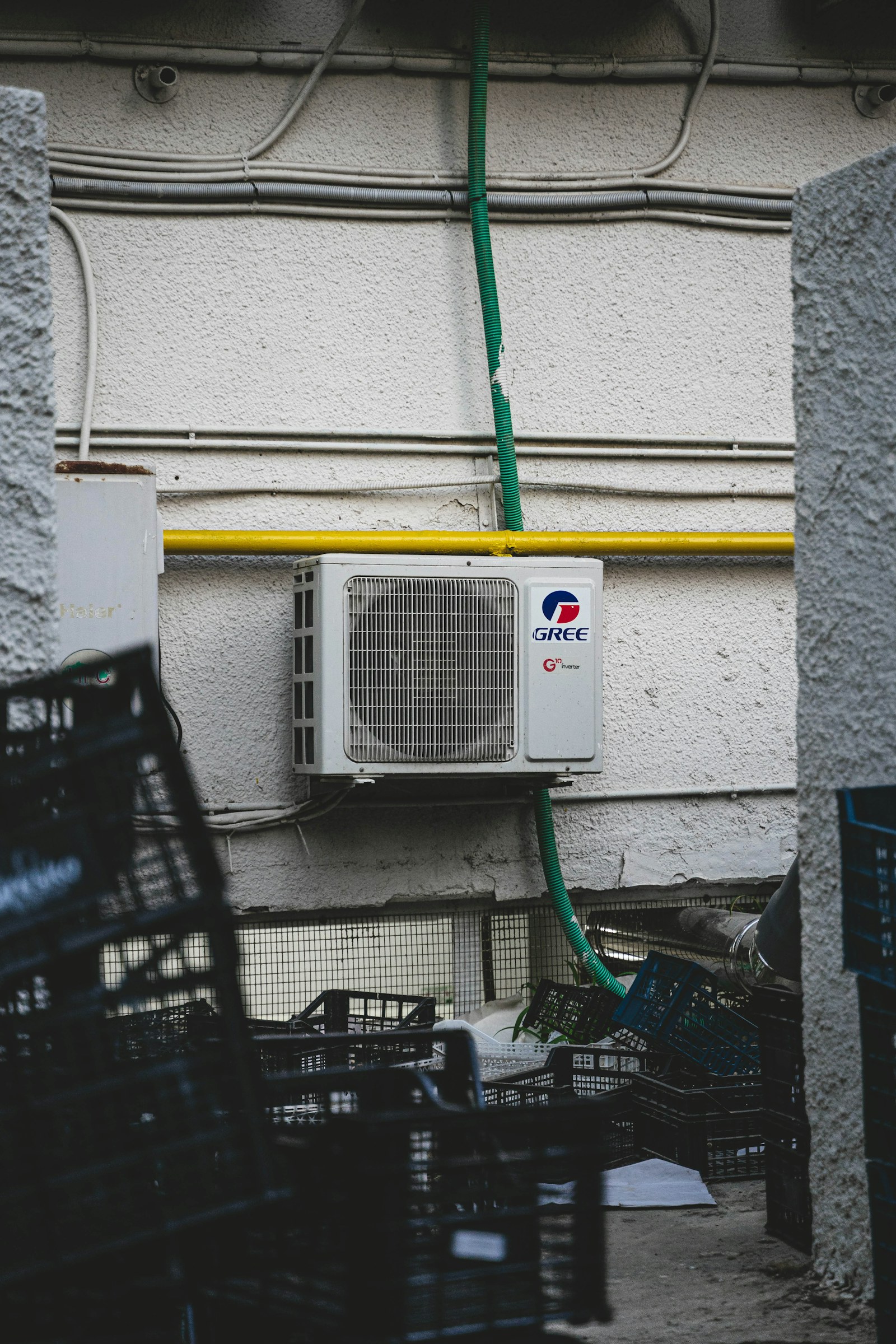 An outdoor heat-pump unit mounted beside a building